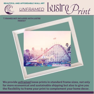 a white frame with a picture of a roller coaster