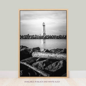 a black and white photo of a lighthouse