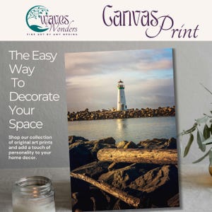 a picture of a lighthouse on a table with a candle