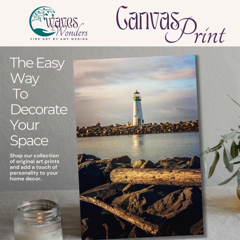 a picture of a lighthouse on a table with a candle