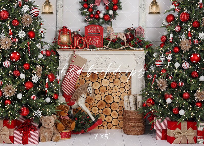 May include: Christmas backdrop featuring decorated trees either side of a fireplace. The trees are decorated with red and white baubles and lights. A fireplace mantel displays a wreath, lantern, and stocking. Presents and a rocking horse are at the base.