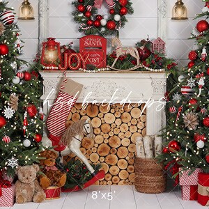 May include: A festive Christmas backdrop featuring two decorated trees with red and white baubles, garlands, and lights. A fireplace mantel displays a wreath, lantern, and a "JOY" sign. Presents and a rocking horse are at the base.