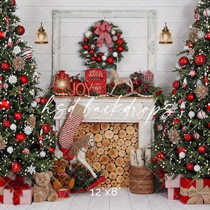 May include: A Christmas-themed backdrop with two decorated trees adorned with red baubles, white lights, and decorative elements. A fireplace mantel displays a wreath, lanterns, and a stocking. The scene includes wrapped gifts and a rocking horse.