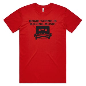 May include: Red t-shirt with black text that reads "Home Taping Is Killing Music" and a cassette tape with skull and crossbones below it. The text below the cassette tape reads "And It's Illegal."