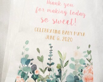 May include: A white favor bag with a floral design and the text "Thank you for making today so sweet! Celebrating Baby Maya June 6, 2020".