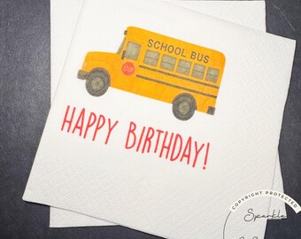 May include: White paper napkins with a yellow school bus illustration and the words "HAPPY BIRTHDAY!" in red. The school bus has black wheels and the words "SCHOOL BUS" printed on the side.
