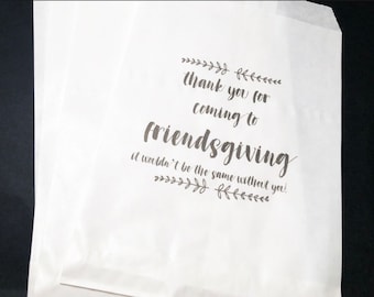 May include: White paper bag with the text "Thank you for coming to Friendsgiving. It wouldn't be the same without you!" printed in black.