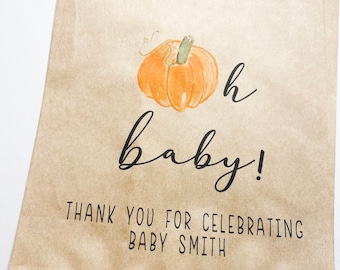 May include: A brown paper bag with a pumpkin illustration and the text "Oh baby! Thank you for celebrating Baby Smith."