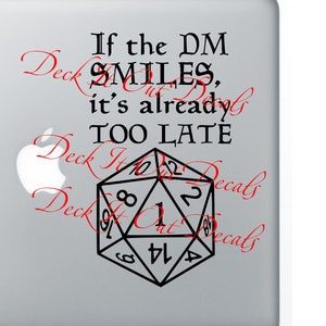 May include: A black and white sticker with a 20-sided die and the text "If the DM smiles, it's already too late".