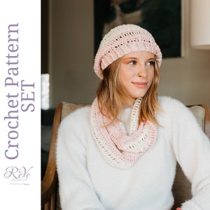 May include: A crochet set in shades of pink and white, including a hat and infinity scarf. The text "Crochet Pattern Set" is visible on the left side of the image. The set is made of a soft, open-weave material.
