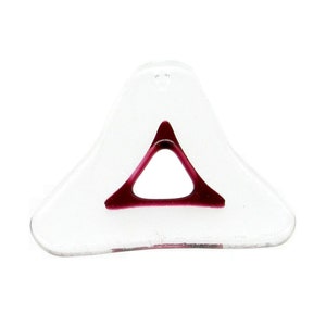 May include: A clear glass triangle with a burgundy triangle inside.
