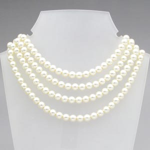 May include: A set of three ceramic mugs with a speckled, matte finish. The mugs are in shades of cream, light gray, and dark gray. Each mug has a simple, minimalist design and a rounded handle.