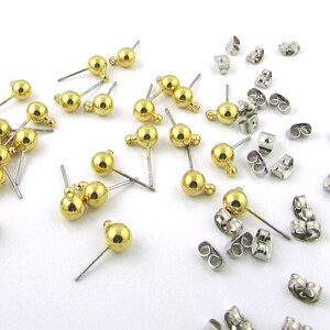 Post earring findings have a 6 millimeter shiny, gold plated brass ball and loop attached to a  7/16 inch stainless steel post. Shown with optional butterfly clutches.
