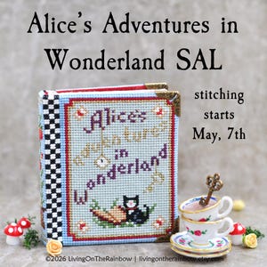 May include: A cross-stitch book with the title "Alice's Adventures in Wonderland", featuring a black cat and carrot design. The book is displayed with teacups and decorative mushrooms. The text "stitching starts May, 7th" is also visible.