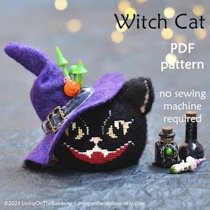 May include: A black cat wearing a purple witch hat with a small orange pumpkin and green mushrooms on top. The cat has a stitched-on face with a red mouth and yellow eyes. The text "Witch Cat" is at the top of the image, and "PDF pattern no sewing machine required" is below the cat.