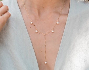 Freshwater pearl lariat necklace gold. Lariat gold necklace. Pearl y necklace gold. Lariat & y necklaces. Pearl necklace. June birthstone.
