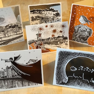 Zes verijdelde kerstkaarten met illustraties van Edinburgh. 3 zilver en 3 koper. Blanco binnenin, elke A6-kaart wordt geleverd met een envelop