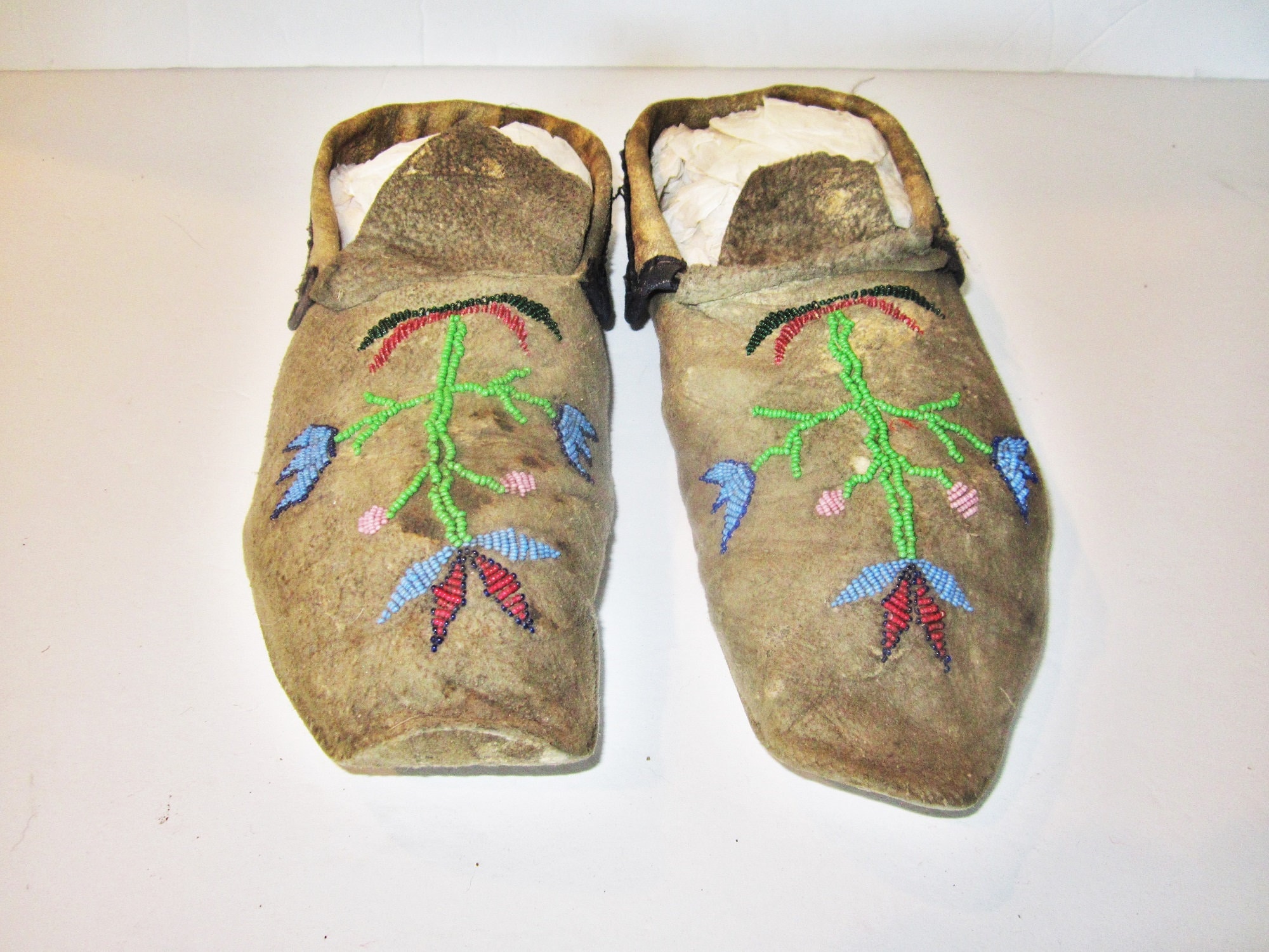 Santee Sioux Beaded Adult Moccasins early Twentieth Century Black Dyed Buckskin Parfleche Soles Sinew Sewn