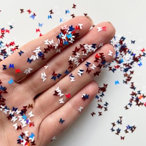 Nail art papillon confettis paillettes du 4 juillet
