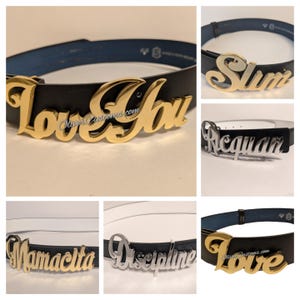 Puede incluir: Una colección de cinturones de cuero negro con hebillas con placa de nombre doradas o plateadas. Las hebillas presentan varios nombres y frases, incluyendo "Love You", "Slim", "Ricquan", "Mamacita", "Discipline" y "Love". Los cinturones tienen un diseño clásico.