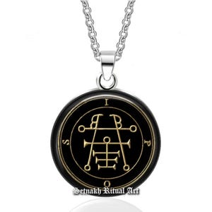 May include: A silver chain necklace with a circular black pendant. The pendant features gold-colored symbols and the text "Setnakh Ritual Art". The pendant is round and has a silver bail.