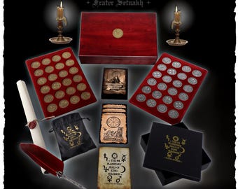 May include: A collection of 44 planetary seals of King Solomon, including two display trays with gold and silver-toned coins, a wooden box, a black drawstring pouch, a scroll with a wax seal, a red quill pen, and printed cards with text.