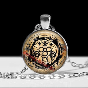 May include: A set of three ceramic mugs with a speckled, matte finish. The mugs are in shades of blue, green, and white. Each mug has a simple, modern design, perfect for coffee or tea. The mugs are stacked on top of each other.