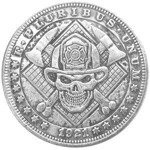 May include: A silver coin featuring a skull wearing a firefighter's helmet, crossed axes, and the text "E PLURIBUS UNUM" and "1921". The coin has a detailed design with stars around the edge.