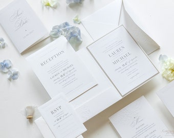 Puede incluir: Conjunto de invitaciones de boda blancas con borde gris. La invitación presenta el texto "Lauren & Michael" y la fecha "Sábado, 24 de septiembre". La tarjeta de recepción presenta el texto "Recepción" y la fecha "Sábado, 24 de septiembre". La tarjeta RSVP presenta el texto "RSVP" y la fecha "04 de septiembre". La tarjeta de menú presenta el texto "Menú" y los textos "Platters" y "Plato principal".