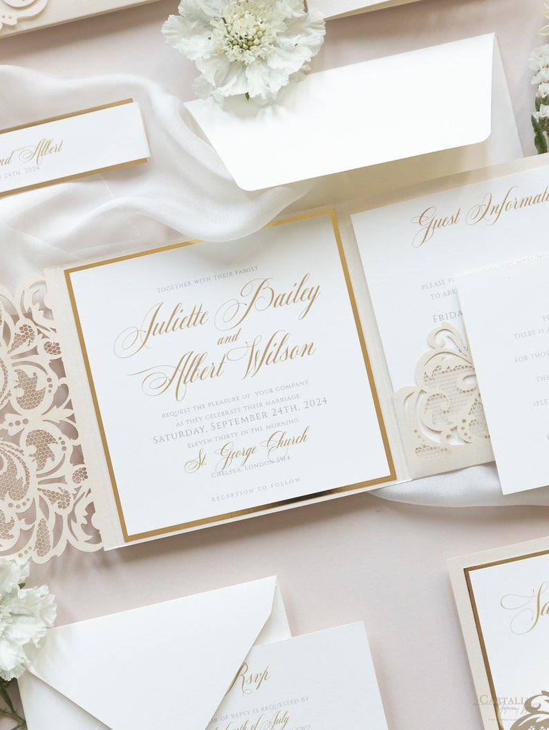 May include: A wedding invitation with a gold and white color scheme. The invitation features a laser-cut design with a floral pattern. The text on the invitation reads "Together with their family, Juliette Bailey and Albert Wilson request the pleasure of your company as they celebrate their marriage, Saturday, September 24th, 2024, Eleven Thirty in the Morning, St. George Church, Chelsea London SW1, Reception to follow."