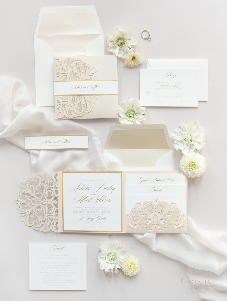 May include: A wedding invitation suite with a laser-cut design in a cream color with gold accents. The invitation features the names "Juliette Bailey and Albert Wilson" and the date "Saturday, September 24th, 2014". The invitation also includes the location "St. George Church".