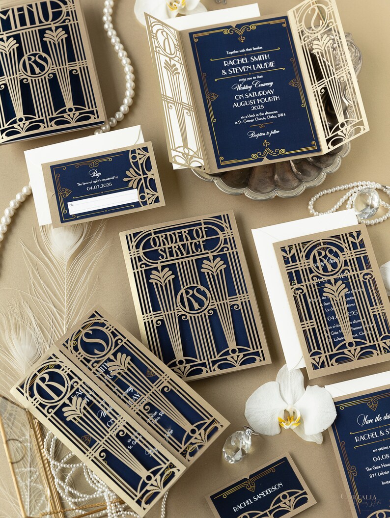 May include: Gold and navy blue wedding invitation suite with intricate laser cut designs. The invitation features the couple's names and wedding date. The RSVP card has a gold border and the text "RSVP by 04.07.2025". The order of service card has a gold border and the text "Order of Service".