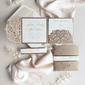 May include: A wedding invitation suite with a laser-cut design in a beige color. The invitation features the names "Juliette Bailey and Albert Wilson" and the date "September 24th, 2020". The invitation is accompanied by a RSVP card and a details card.