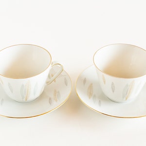 Two Schumann Arzberg porcelain cups and saucers, mid-century German porcelain cup and saucer, stylized leaves, Arzberg Bavaria china cups