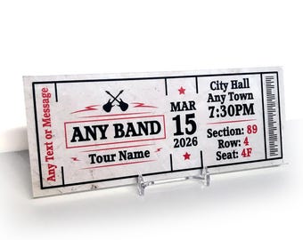 May include: A concert ticket with a vintage design. The ticket features the text "ANY BAND" and "Tour Name" in a red and black color scheme. The date is March 15, 2026, at 7:30 PM at City Hall, Any Town. The ticket also includes section, row, and seat information.