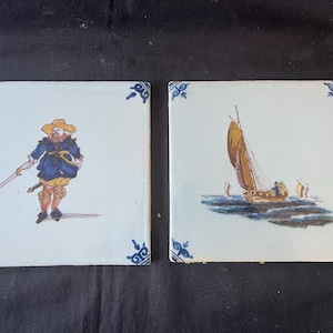 set of 2 antique Dutch Delft Makkum  Tile . Netherlands . several subjects