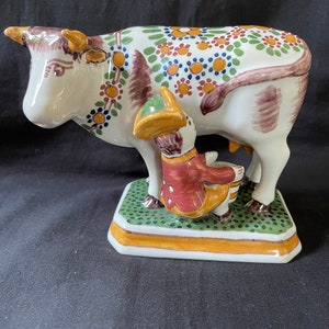 antique dutch Makkum delft large cow being milked . Marked and signed