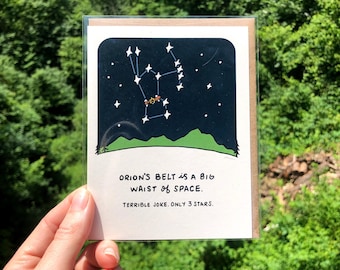 Tarjeta de felicitación con un juego de palabras sobre la cintura del espacio ilustrado con constelaciones