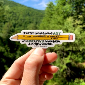 May include: A yellow pencil sticker with the quote "It is the supreme art of the teacher to awaken joy in creative expression & knowledge." by Albert Einstein.