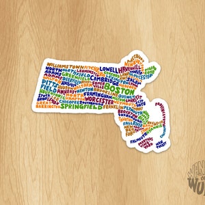 May include: A colorful word cloud map of Massachusetts, with the names of cities and towns in the state. The map is shaped like the state of Massachusetts. The word cloud is in a variety of colors, including red, orange, yellow, green, blue, and purple.