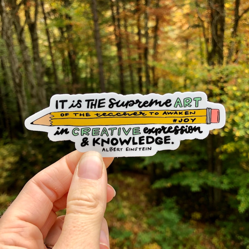 May include: A yellow pencil sticker with the quote "IT is THE Supreme ART OF THE teacher TO AWAKEN #JOY in CREATIVE expression & KNOWLEDGE. ALBERT EINSTEIN"