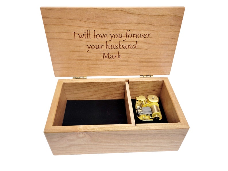 a wooden box with a note inside of it