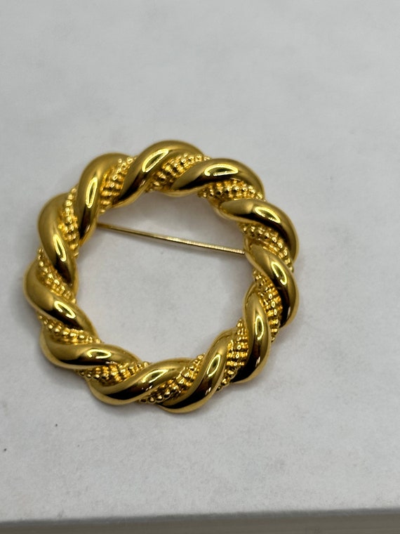 Chunky twisted gold tone Napier circle brooch