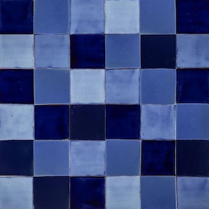 May include: A checkerboard pattern of blue and dark blue ceramic tiles. The tiles are arranged in a grid pattern, with alternating colours.