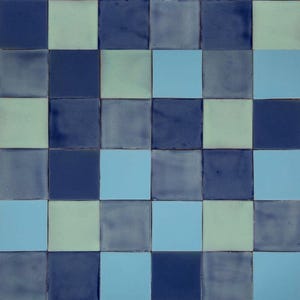 May include: A checkerboard pattern of blue, light blue, and green ceramic tiles.