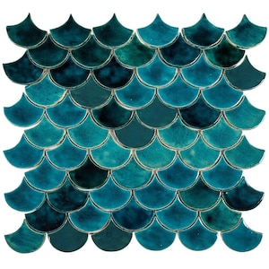 May include: Teal blue ceramic mosaic tiles in a fish scale pattern. The tiles are arranged in a staggered pattern, creating a textured surface.