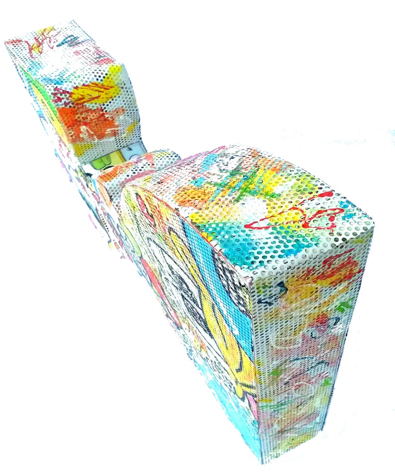 May include: A colorful, abstract sculpture made of metal mesh. The sculpture is painted with bright colors and has a unique, organic shape.