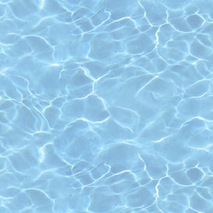 May include: A close-up of a blue pool with rippling water. The water is clear and reflects the sunlight.