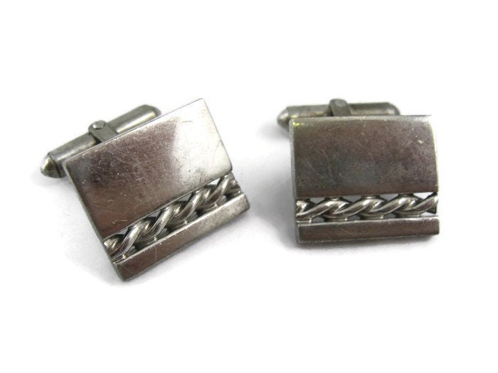 Silver cufflinks with all-over logo