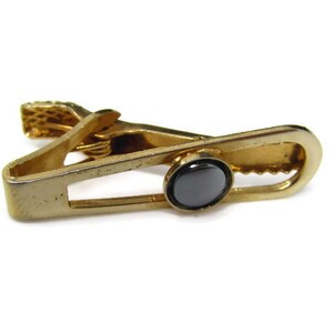 Vintage Tie Bar Tie Clip: Hematite Center Accent Open Middle Design Gold Tone